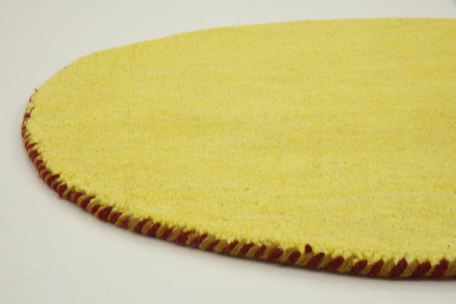 Yellow 2' 4 x 2' 4 Solid Gava Round Area Rug 100% High Quality All Natural Wool Minimalist Carpet for Modern Home Interior Design for Sale at Rug Engine