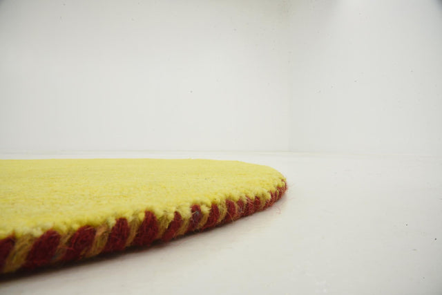 Yellow 2' 4 x 2' 4 Solid Gava Round Area Rug 100% High Quality All Natural Wool Minimalist Carpet for Modern Home Interior Design for Sale at Rug Engine