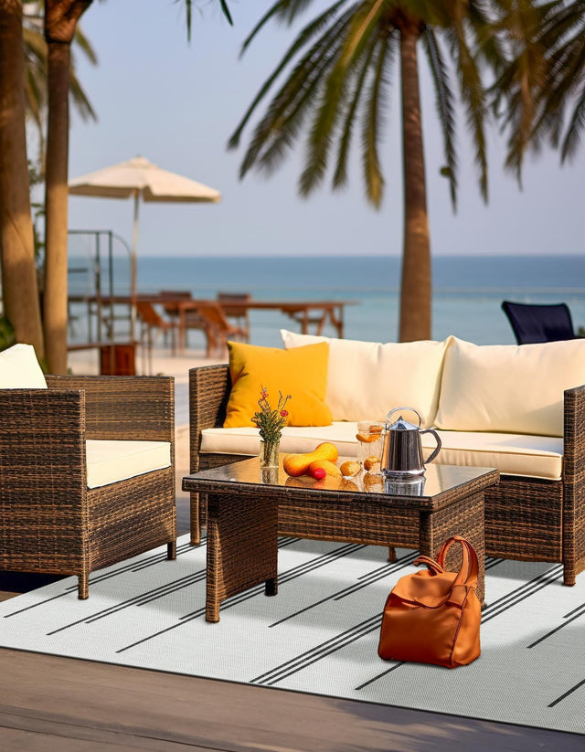White and Black 4' 1 x 6' 1 Outdoor Modern Rectangle Area Rug Weather Resistant for Patio, Deck, Terrace, Balcony, Porch 100% Polypropylene Modern Outside Carpet for Sale at Rug Engine