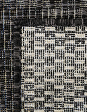 Black 4' 1 x 6' 1 Outdoor Solid Rectangle Rug