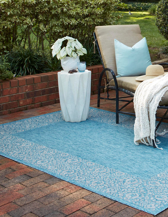 Aqua 4' 1 x 6' 1 Outdoor Border Rectangle Area Rug Weather Resistant for Patio, Deck, Terrace, Balcony, Porch 100% Polypropylene Classic Bordered Carpet for Sale at Rug Engine