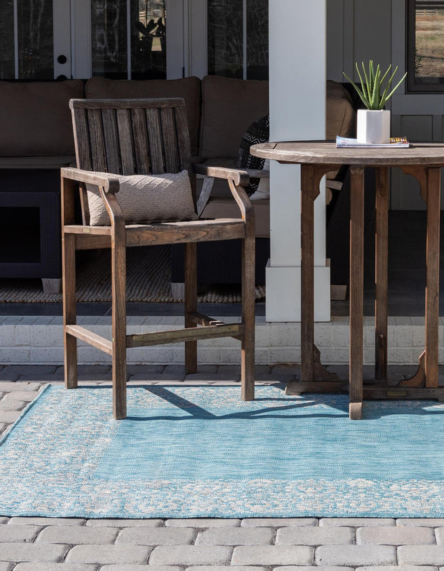 Aqua 4' 1 x 6' 1 Outdoor Border Rectangle Area Rug Weather Resistant for Patio, Deck, Terrace, Balcony, Porch 100% Polypropylene Classic Bordered Carpet for Sale at Rug Engine