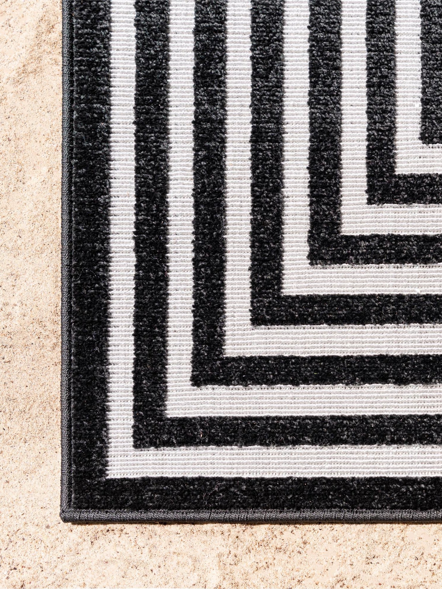 Black 5' 1 x 8' Sabrina Soto Outdoor Rectangle Area Rug Weather Resistant for Patio, Deck, Terrace, Balcony, Porch Durable Carpet for Exterior Home Design for Sale at Rug Engine