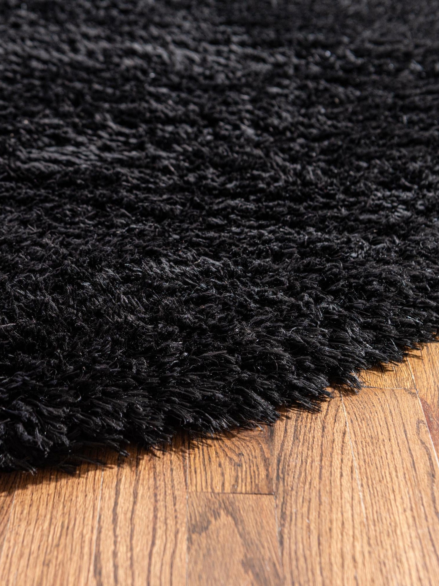 Onyx Black 4' 1 x 4' 1 Infinity Shag Round Area Rug Thick Soft Touch Fluffy & Plush Shaggy Pile 100% Polypropylene With Jute Backing Solid Color Minimalist Carpet for Sale at Rug Engine