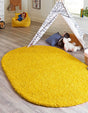Tuscan Sun Yellow 5' 3 x 8' Solid Shag Oval Area Rug Thick Soft Touch Fluffy & Plush Shaggy Pile Durable Minimalist Carpet for Classic Interior Design for Sale at Rug Engine