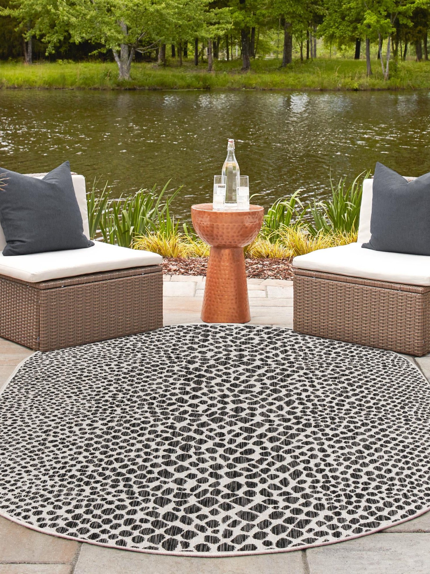 Black 7' 10 x 10' Jill Zarin Outdoor Oval Area Rug Weather Resistant for Patio, Deck, Terrace, Balcony, Porch Durable 100% Polypropylene Carpet for Outside for Sale at Rug Engine