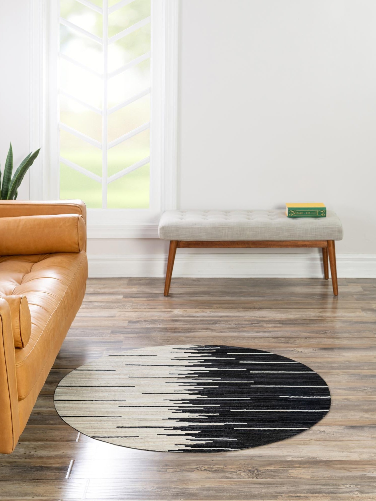 Authentic Luxury Black White 4' 1 x 4' 1 Cowhide Leather Round Area Rug Modern Interior Design 100% Real Natural Cowhide Carpet for Designer Home Decor for Sale at Rug Engine