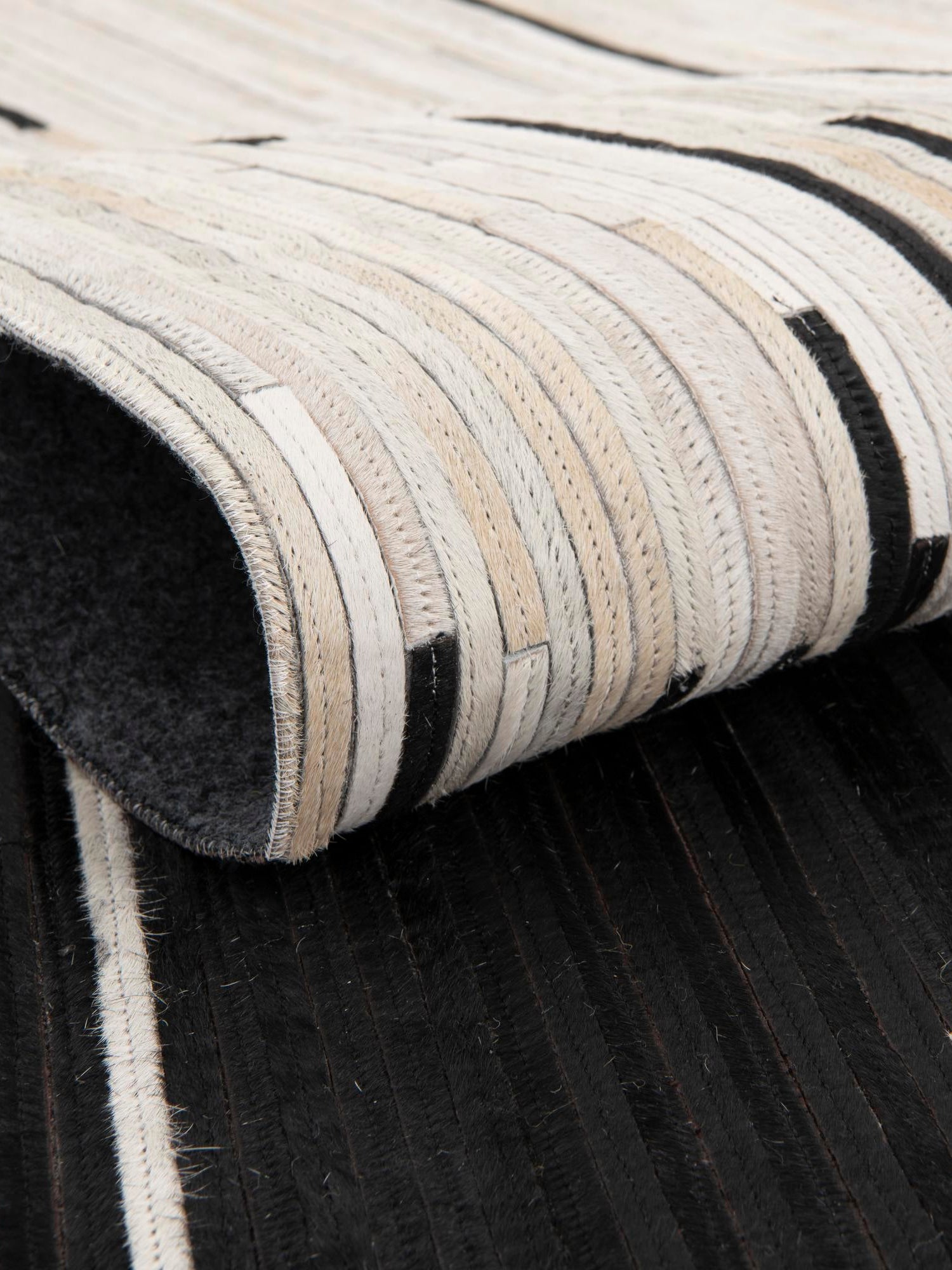 Authentic Luxury Black White 4' 1 x 4' 1 Cowhide Leather Round Area Rug Modern Interior Design 100% Real Natural Cowhide Carpet for Designer Home Decor for Sale at Rug Engine