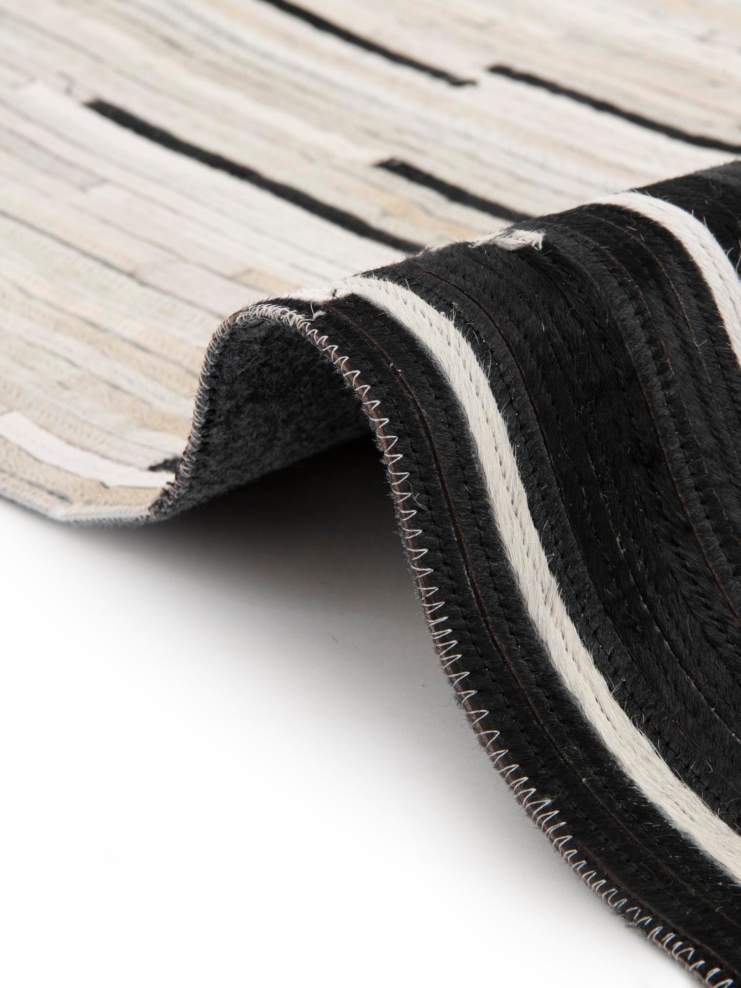 Authentic Luxury Black White 4' 1 x 4' 1 Cowhide Leather Round Area Rug Modern Interior Design 100% Real Natural Cowhide Carpet for Designer Home Decor for Sale at Rug Engine