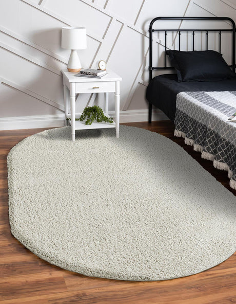 White 4' 1 x 6' 1 Soft Solid Shag Oval Rug