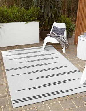 White and Black 4' 1 x 6' 1 Outdoor Modern Rectangle Area Rug Weather Resistant for Patio, Deck, Terrace, Balcony, Porch 100% Polypropylene Modern Outside Carpet for Sale at Rug Engine