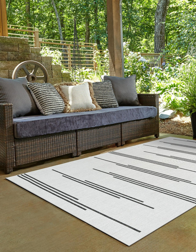White and Black 4' 1 x 6' 1 Outdoor Modern Rectangle Area Rug Weather Resistant for Patio, Deck, Terrace, Balcony, Porch 100% Polypropylene Modern Outside Carpet for Sale at Rug Engine