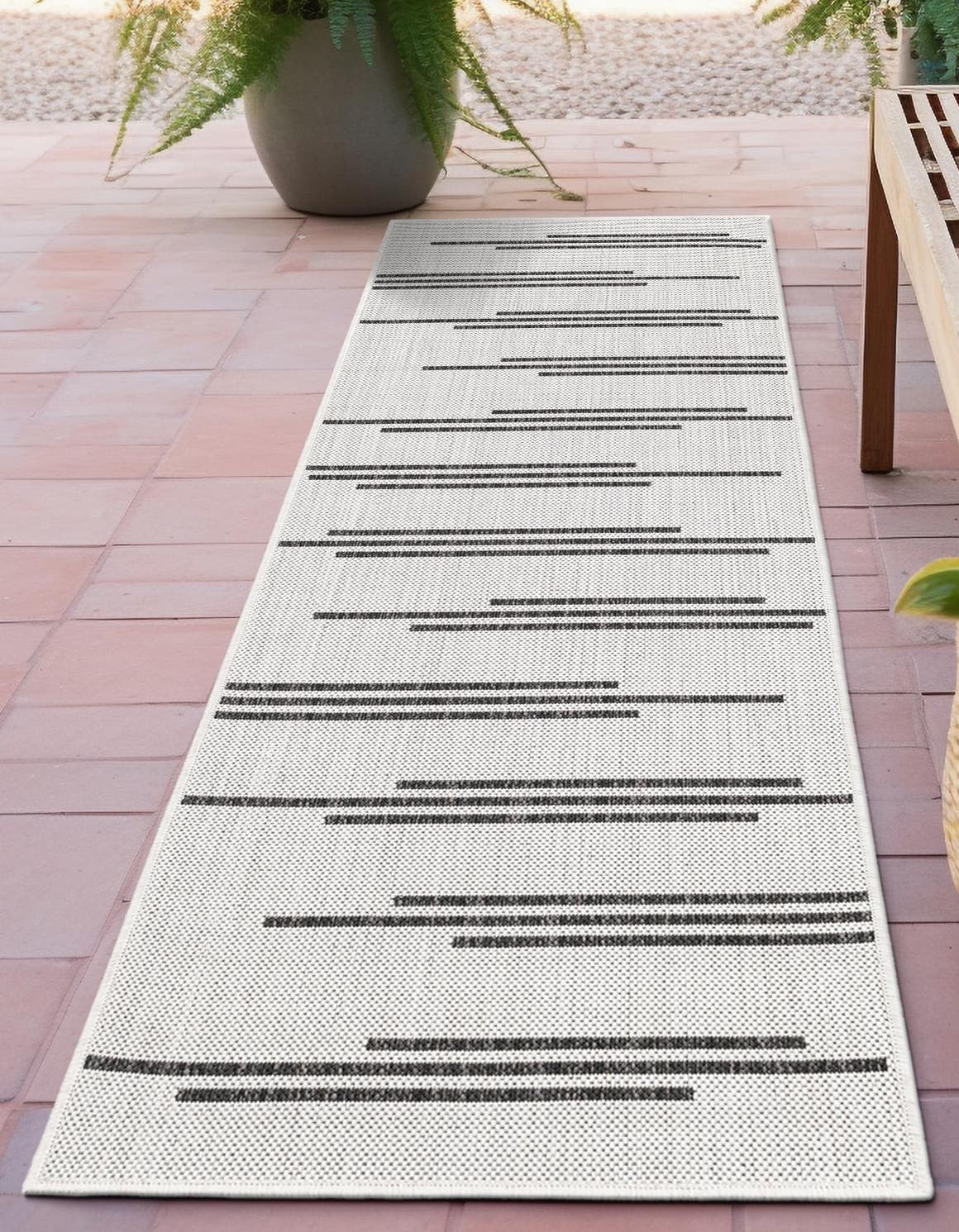 White and Black 2' x 6' 1 Outdoor Modern Runner Area Rug Weather Resistant for Patio, Deck, Terrace, Balcony, Porch 100% Polypropylene Modern Outside Carpet for Sale at Rug Engine