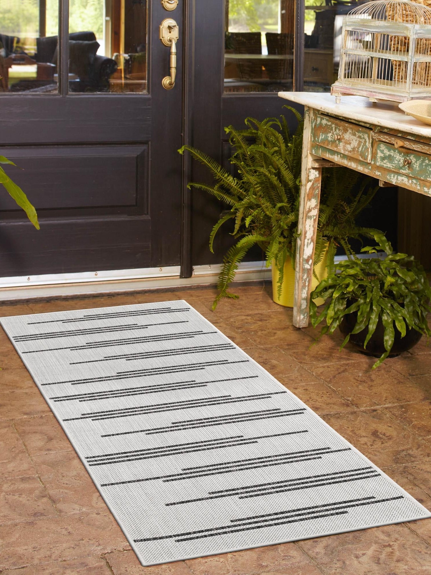 White and Black 2' x 5' 3 Outdoor Modern Runner Area Rug Weather Resistant for Patio, Deck, Terrace, Balcony, Porch 100% Polypropylene Modern Outside Carpet for Sale at Rug Engine