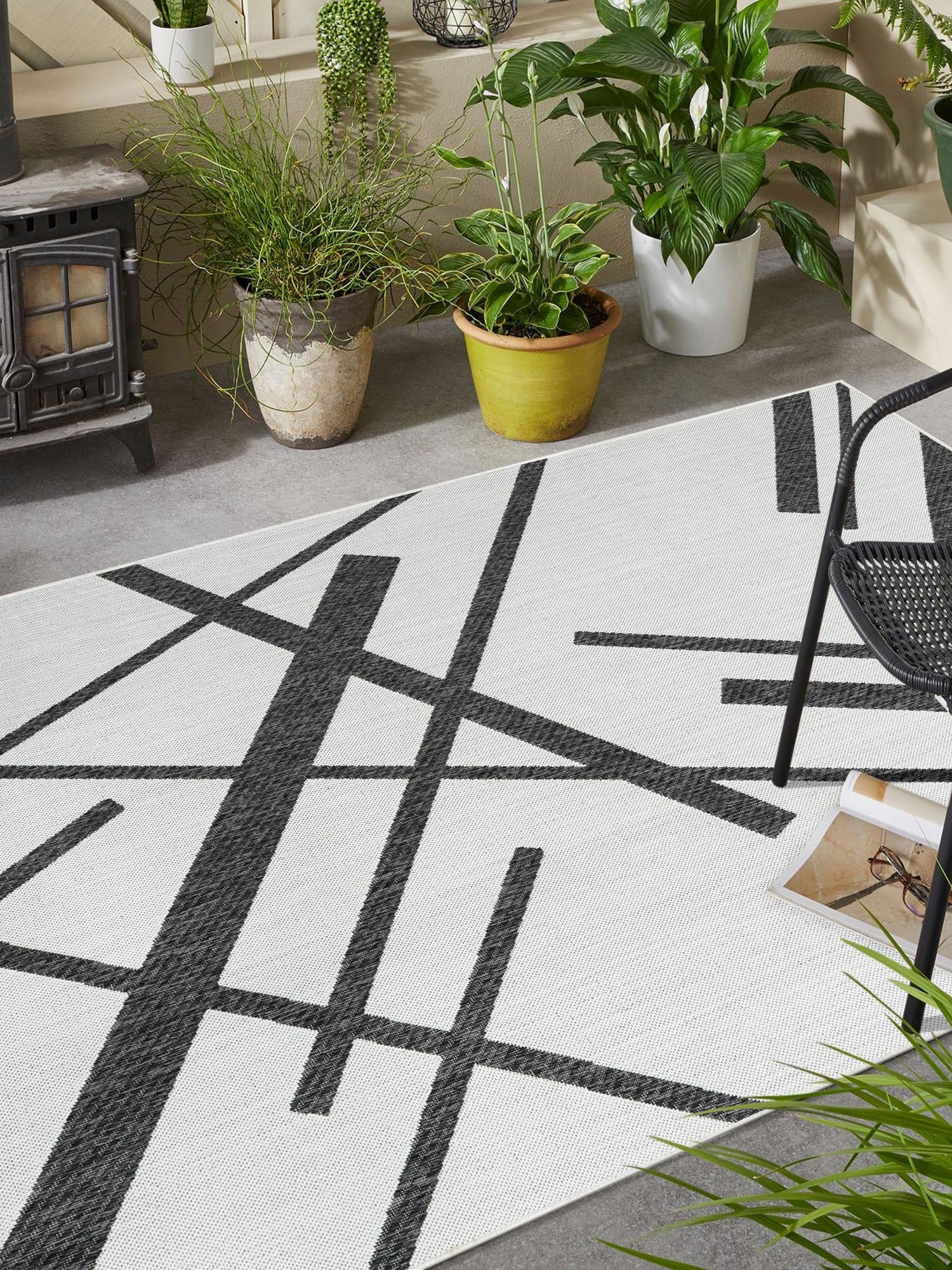 Black and White 4' 1 x 6' 1 Outdoor Modern Rectangle Area Rug Weather Resistant for Patio, Deck, Terrace, Balcony, Porch 100% Polypropylene Modern Outside Carpet for Sale at Rug Engine