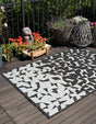 Black and White 4' 1 x 6' 1 Outdoor Modern Rectangle Area Rug Weather Resistant for Patio, Deck, Terrace, Balcony, Porch 100% Polypropylene Modern Outside Carpet for Sale at Rug Engine