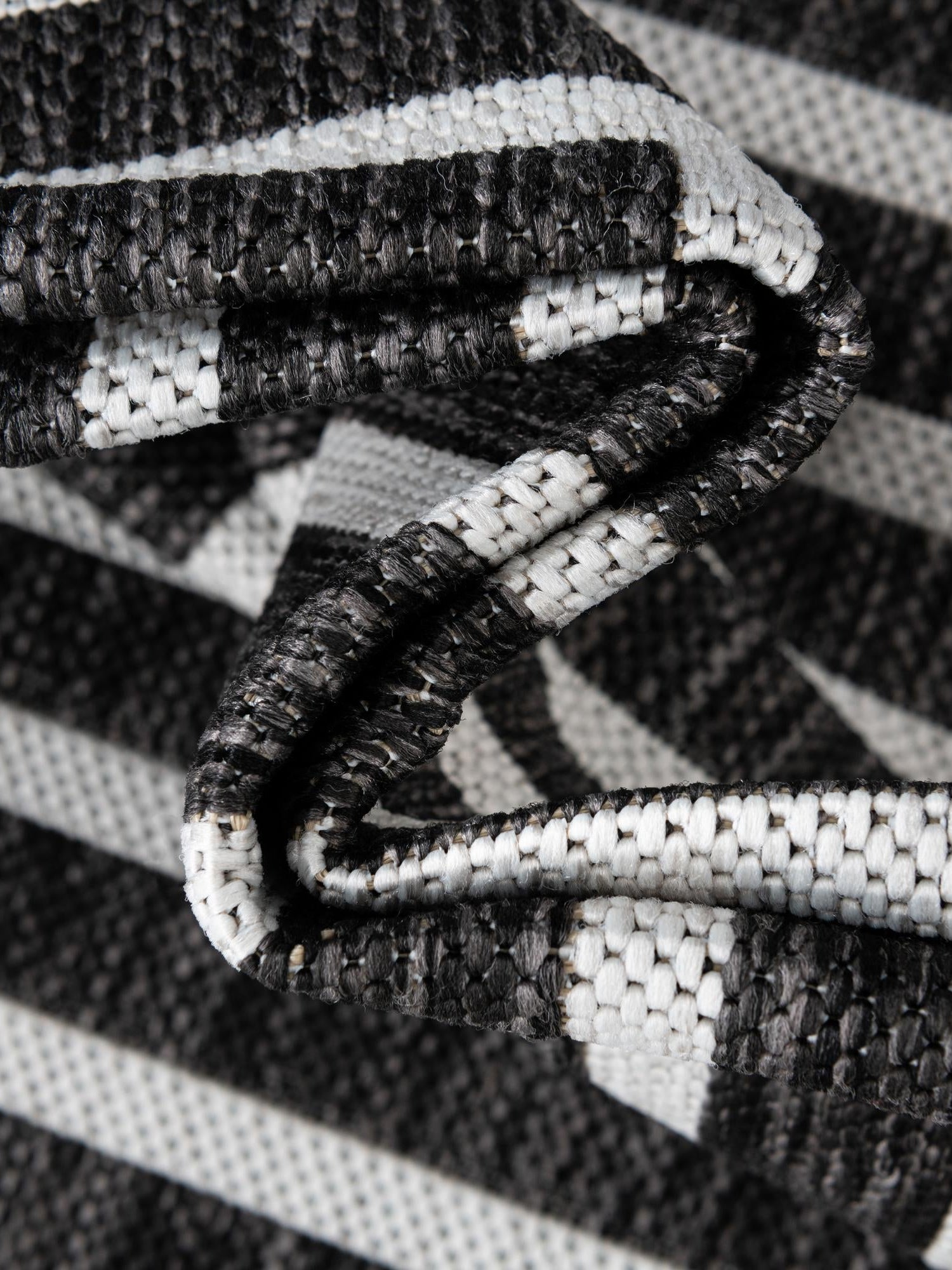 Black and White 4' 1 x 6' 1 Outdoor Modern Rectangle Area Rug Weather Resistant for Patio, Deck, Terrace, Balcony, Porch 100% Polypropylene Modern Outside Carpet for Sale at Rug Engine