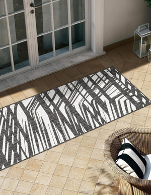 Black and White 2' x 8' Outdoor Modern Runner Area Rug Weather Resistant for Patio, Deck, Terrace, Balcony, Porch 100% Polypropylene Modern Outside Carpet for Sale at Rug Engine