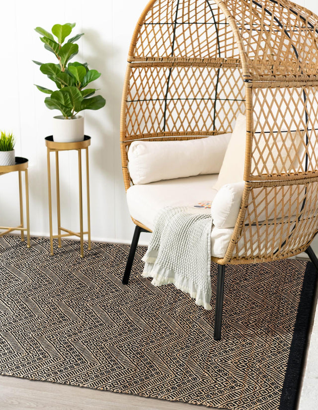 Black and Natural 4' 1 x 6' 1 Braided Jute Rectangle Rug